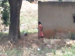 desi lady pissing behind her house